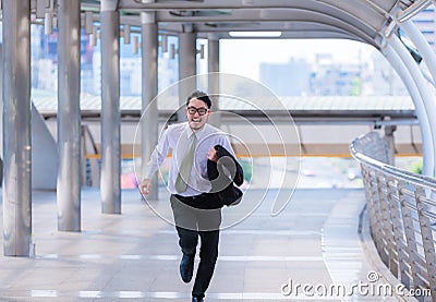 Stressed anxious businessman in a hurry and running, he is late for his business appointment and Wear a shirt while running. Stock Photo