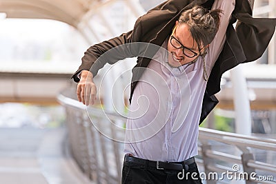 Stressed anxious businessman in a hurry and running, he is late for his business appointment and Wear a shirt while running Stock Photo