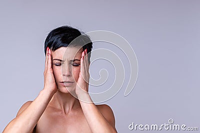 Stressed anxious woman with a headache Stock Photo