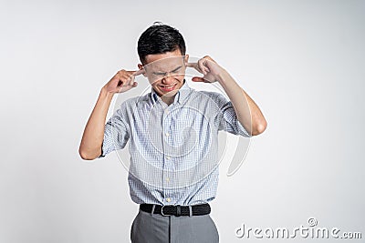 Stressed asian young young man holding head Stock Photo