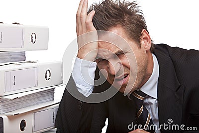 Stressed business man has bad headache in office Stock Photo