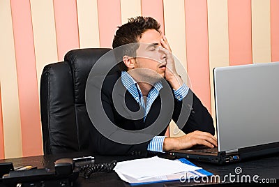 Stressed business man with problems at laptop Stock Photo