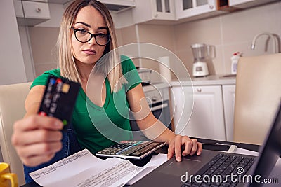 Stressed business woman at home working - paying bills e banking Stock Photo