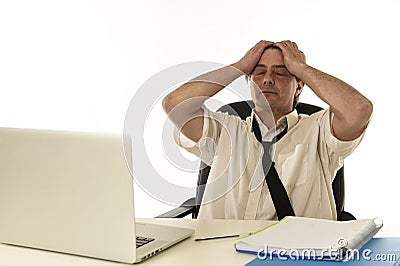 Stressed businessman on his 40s with loose tie and messy look g Stock Photo