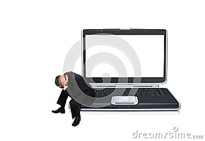 Stressed businessman on laptop Stock Photo