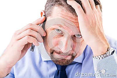 Stressed businessman making a phone call. Stock Photo