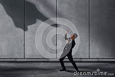 Stressed Businessman in Under Pressured Concept, Small Worker Sc Stock Photo