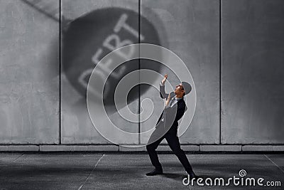 Stressed Businessman in Under Pressured Concept, Small Worker Sc Stock Photo