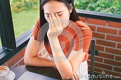 Stressed businesswoman headache working on laptop computer. Negative human emotion facial expression feelings Stock Photo