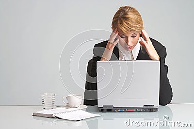 Stressed businesswoman with laptop has headache Stock Photo