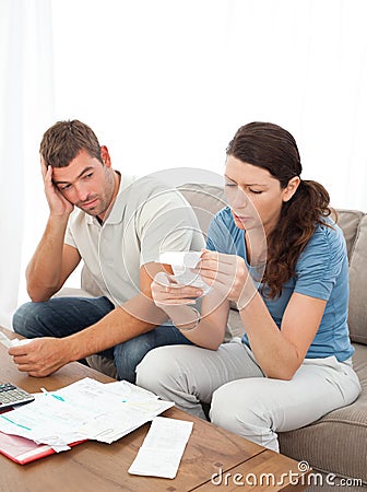 Stressed couple doing their accounts Stock Photo