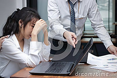 Stressed depressed young Asian business woman are being blamed with boss in workplace of office. Stock Photo