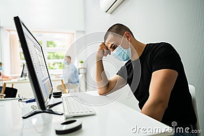 Stressed Employee In Office Wearing Mask Stock Photo