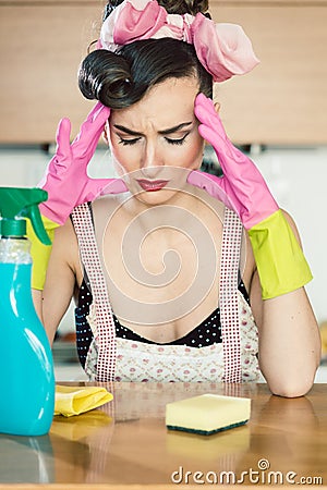 Stressed housewife having headache and migraine Stock Photo