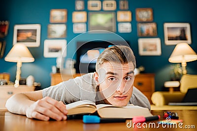 Stressed lazy student home studying.Online-only learning classes homework.Exam material understanding problem.Difficult Stock Photo