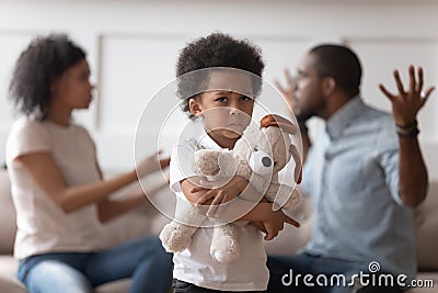 Stressed lonely kid boy suffering from family conflicts. Stock Photo