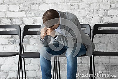 Stressed male applicant feel anxious before work interview Stock Photo