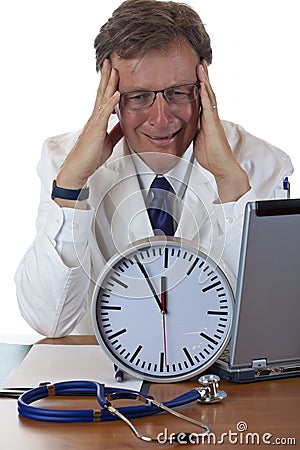 Stressed medical doctor under time pressure Stock Photo