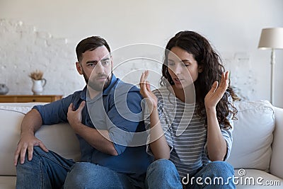 Stressed millennial husband and wife facing conflict Stock Photo