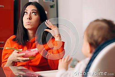 Baby Not Eating and Mother Ignoring Her Protesting Stock Photo