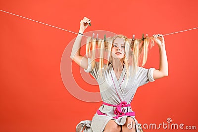 Stressed retro housewife. Maid or housewife cares about house. Vintage housekeeper woman. Busy mother. Multitasking mom Stock Photo