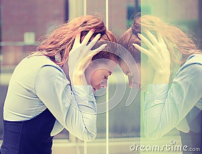 Stressed sad young woman outdoors. Urban life style stress Stock Photo