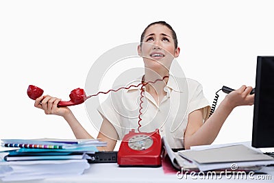 Stressed secretary answering the phones Stock Photo