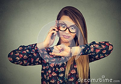 Stressed surprised business woman looking at wrist watch, running late for meeting Stock Photo