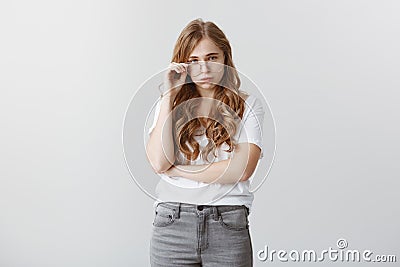 Stressed and tired coworker cannot handle load of paper work. Portrait of fed up bored european female with blond hair Stock Photo