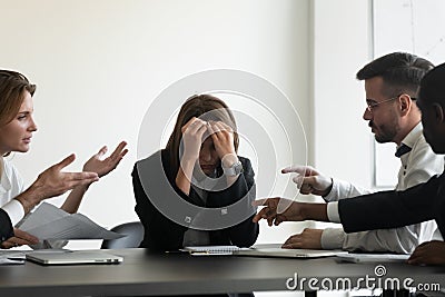 Stressed upset business woman suffer from bullying harassment at workplace Stock Photo