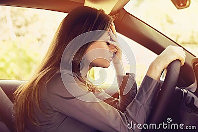 Stressed woman driver sitting inside her car Stock Photo