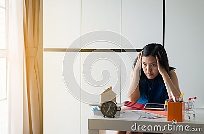 Stressed woman managing debt,House bills with taxes and bank account balance,Financial Management Concepts Stock Photo