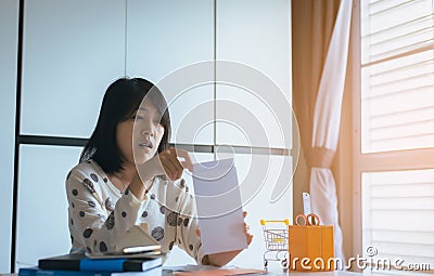 Stressed woman open the envelope managing debt,Electricity and water bill Stock Photo