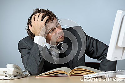 Stressed young businessman Stock Photo