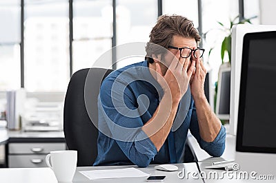 Stressed young businessman Stock Photo