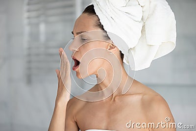 Stressed young hispanic woman checking breath freshness. Stock Photo