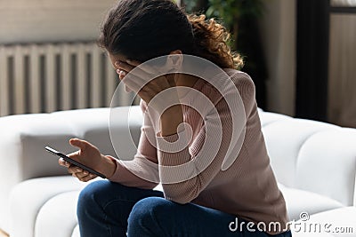 Stressed young latin lady get nasty blackmail message on email Stock Photo