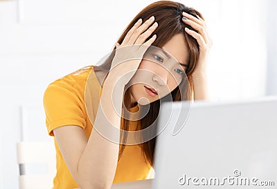 Stressed young using laptop at home Stock Photo