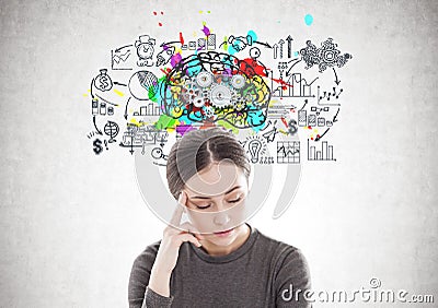 Stressed young woman in brown, cog brain Stock Photo