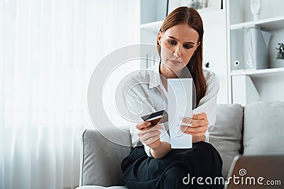 Stressed young woman has financial problems credit card debt to pay utmost Stock Photo