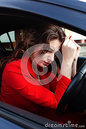 Stressful beautiful girl in the car Stock Photo