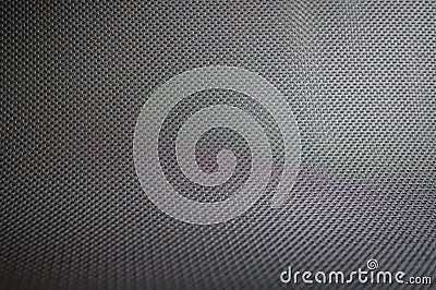 Stretched grey mesh textured polyester fabric. Stock Photo