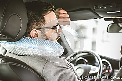 Stretching in car. Stock Photo