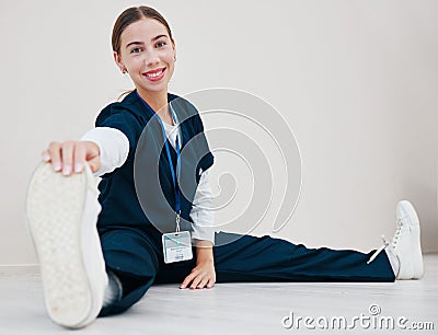 Stretching, feet and nurse with legs on floor in exercise at the start of shift in clinic internship or healthcare. Work Stock Photo