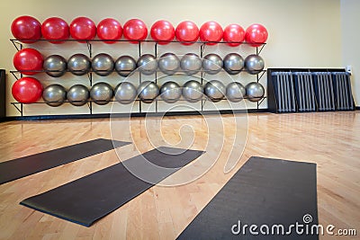 Stretching mats and exercise balls in gym Stock Photo