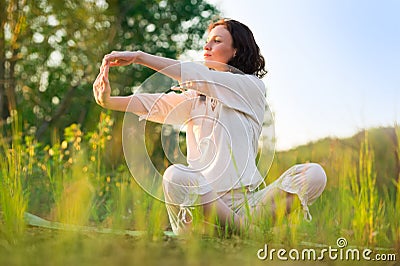 Stretching woman in outdoor exercise smiling happy doing yoga Stock Photo