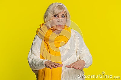 Strict senior woman warning hands gesture, saying no, be careful, advice to avoid danger, caution Stock Photo