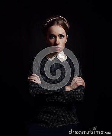 Strict woman in black clothes Stock Photo