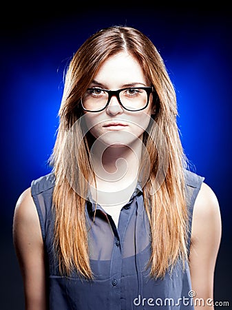 Strict young woman with nerd glasses Stock Photo