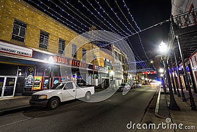String lights hung over Dauphin Street, and buildings in downtown Mobile, Alabama Editorial Stock Photo